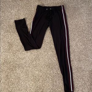 black leggings with red and white stripes